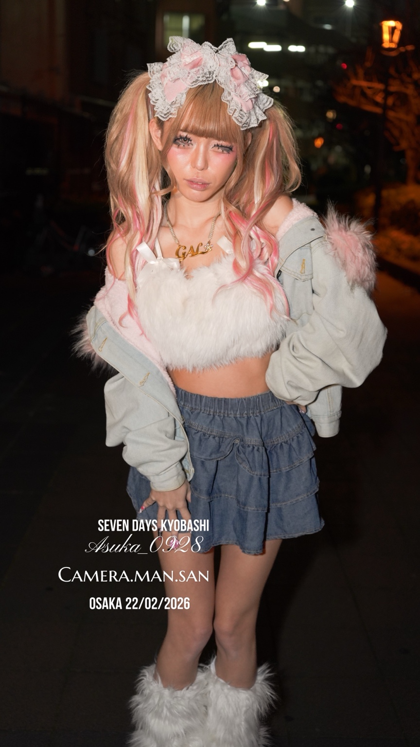 Full-length night portrait with a pink and white lace headpiece